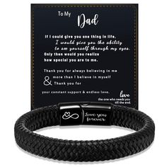 a black leather bracelet with the message to my dad on it and an engraved card