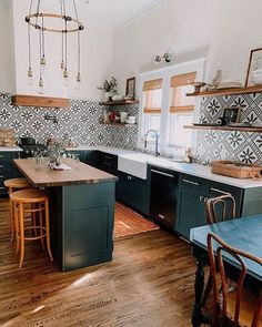 the kitchen is clean and ready to be used for cooking or baking, while also being used as a dining area