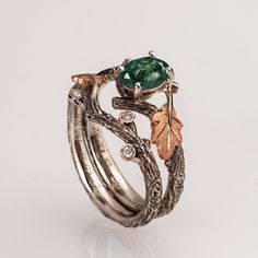 "A handmade 14k twig and leaf ring made in two gold colors and set with a natural, high-quality moss agate of your choosing and three small diamonds. The grooves in the band are plated with black rhodium which emphasizes the texture. if you prefer not to apply the black rhodium that is fine. I can also use white, rose or yellow gold for the band and the leaves for the same price. The ring in the pictures is set with a 7mmX5mm oval-shaped moss agate but can be set with any other stone, please contact me for a quote. If you are looking at this ring then you are probably looking for something special, something different. The engagement rings I design are made of 100% recycled gold and non-conflict diamonds of high quality. After I am sure you have seen a huge variety of engagement rings I am Twig Engagement Ring, Cute Engagement Rings, Fantasy Wedding, Leaf Ring, Oak Leaf, Fancy Jewelry, Pretty Rings, Black Rhodium, Fantasy Jewelry