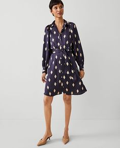 Elevate your wardrobe with the Ann Taylor Geo Collared Belted Shirtdress, a masterpiece of style and comfort. This dress is perfect for those who appreciate elegance with a touch of simplicity.

- **Size:** 16
- **Color:** Night Sky
- **Material:** 100% Polyester
- **Gender:** Female
- **Sleeve Length:** Long sleeves with shirred caps and button cuffs
- **Features:** Point collar, button front, self-tie belt, front off-seam pockets, back yoke with locker loop
- **Length:** Hits above the knee, 2 Female Features, Female Sleeve, One And Done, Work Dresses For Women, Tall Dresses, Business Casual Outfits For Women, Long Sleeve Dresses, Womens Business Casual, Professional Dresses