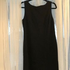 Knee Length, Sleeveless, High Neck , Zippered Back Lines Black Dress. New With Tags Size 8 Elegant Black Tank Top For Formal Occasions, Formal Black Sleeveless Dress With Back Zipper, Formal Sleeveless Dress With Back Zipper, Formal Sleeveless Mini Dress With Back Zipper, Formal Black Sleeveless Tank Top, Fitted Black Tank Top For Formal Occasions, Black Sleeveless Dress With Back Zipper For Work, Formal Sleeveless Lined Mini Dress, Formal Sleeveless Lined Midi Dress