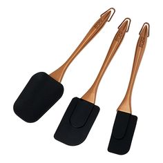 three wooden utensils with black handles on a white background