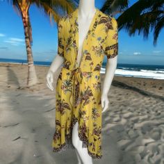 Self Tie Front, Flounce Hem, Short Sleeve, V Neckline. Bust 36”, Length 43”-50”. **Does Not Include Slip.** Fitted Yellow Beach Cover-up Dress, Yellow Floral Print Beach Cover-up Dress, Yellow V-neck Beachwear Maxi Dress, Yellow V-neck Maxi Dress Beachwear, Yellow Floral Print Dress For Beach, Mustard Fitted Maxi Dress For Vacation, Fitted Yellow Maxi Dress For Beach, Yellow Maxi Dress For Beach Day Out, Yellow Maxi Dress For Brunch At The Beach