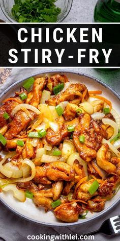 chicken stir fry in a pan with onions and green peppers on the side, next to a