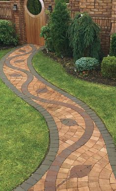 a brick pathway in front of a house