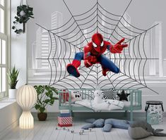 a bedroom with spider man on the wall