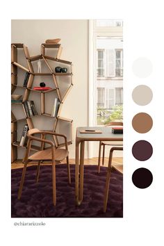 a chair and table in front of a book shelf with books on it's shelves