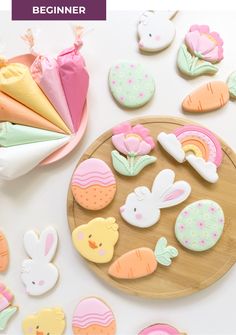 some decorated cookies are on a plate and sitting next to each other with the words beginner