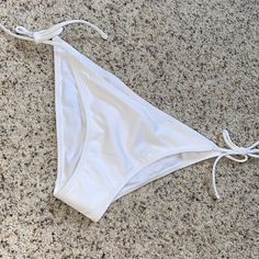 Brand New White Bikini Bottoms. Size Small. Never Worn White Tie-side Bottom Swimwear For Beach Season, White Stretch Swimwear With Tie-side Bottom, White Stretch Tie-side Bottom Swimwear, White Tie-side Bottom Swimwear For Beach Party, White Tie-side Bottoms For Beach Party, White Tie-side Bottoms For Sunbathing, No Boundaries, Boundaries, Womens Swim