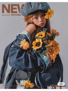 a girl with sunflowers on her head and jacket over her shoulders, standing in front of a magazine cover