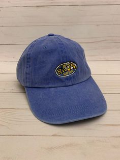 Washed Blue Hat with embroidered surf shop logo Blue Streetwear Hat With Logo Patch, Blue Hat With Logo Patch For Streetwear, Casual Blue Hats With Embroidered Logo, Blue Hats With Embroidered Logo And Curved Brim, Blue Outdoor Hat With Embroidered Logo, Blue Hat With Embroidered Logo, Blue Hats With Embroidered Logo, Blue Dad Hat With Embroidered Logo, Blue Dad Hat With Embroidered Logo And Curved Brim