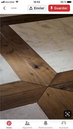 a wooden floor with white and brown tiles on it's sides, as well as a cross section