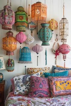 colorful lanterns hang from the ceiling above a bed