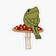 a frog sitting on top of a mushroom with its arms wrapped around it's back