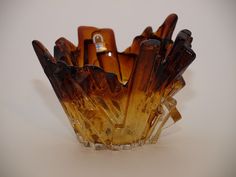 a glass vase filled with lots of brown items