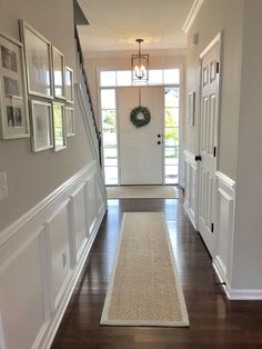 the hallway is clean and ready to be used as a place for pictures on the wall