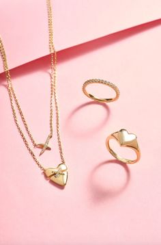 This gold heart-shaped pave necklace is a must-have for the new season, it features a gold heart with a cubic zirconia filled cross at the centre for a touch of sparkle. A dainty piece with a unique edge, it will have you looking the part whatever your plans. • Material: 925 Sterling Silver with 14kt Gold Plating with Cubic Zirconia• Necklace length: 450mm with 50mm extender• Weight: 3.5g Cherry Lady, Ring Stacks, Cross Symbol, Pave Necklace, Hoop Charms, Simple Band, Zirconia Necklace, Everyday Ring, Studded Necklace