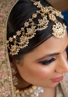 a woman wearing a bridal head piece