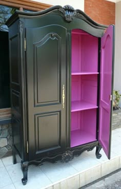 an armoire is painted in black and pink