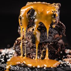 a chocolate cake with caramel drizzled on top