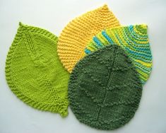 three knitted leaves sitting next to each other