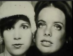 black and white photograph of two women wearing hats