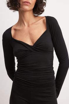 This long sleeve top features a relaxed form fit and a soft stretchy material. It has a wide neckline with a twist detail and draped details. Low Waist Jeans, Twist Top, Summer Wedding Dress, Sleepwear Sets, Wedding Guest Dress Summer, Linen Clothes, Lingerie Sleepwear, Top Hat, Guest Dresses