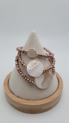 Rose Gold & Pearl Stretchy Bracelets Stack them up OR wear them separately  *Each pearl shell has its own unique color paterns and textures. No two bracelets will be identical due to the organic nature of the shell For fine quality I used gold filled spacer beads. They will be less likely to tarnish and bring a much more elegant class to your bracelet Arrives gift packaged ♡ ♡Order the stack and recieve FREE shipping ! To care for your stretchy bracelets please roll them on and roll them off. Th Elegant Beige Beach Bracelet, Elegant Beige Beaded Bracelets For Beach, Adjustable Rose Gold Bracelets For Beach, Adjustable Rose Gold Pearl Beaded Bracelets, Bracelets Stack, Stack Bracelets, Rose Gold Pearl, Organic Nature, Stretchy Bracelets