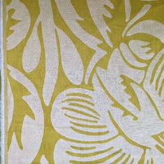 a yellow and white area rug with an abstract design