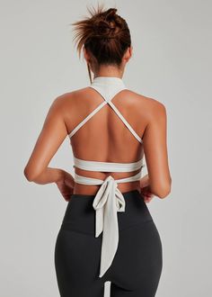 Key Features:

 Light Support : The Lucia Bra offers light support, ideal for yoga, Pilates or any other low-impact exercise. It combines elegance and functionality, allowing complete freedom of movement without restrictions.

 Unique Design : Featuring a crisscross strap design and an adjustable knot at the back, this bralette stands out with its sophisticated look. It is designed not only for sports but also to be worn under casual clothes, offering versatility and style.

 Comfort and Adaptability : With its integrated soft shells and adjustable straps, it adapts perfectly to your body, ensuring comfort and support while highlighting the silhouette.

 Zoom on the Fabric:

 Composition : Made with 90% Nylon and 10% Elastane, the Lucia Bra combines durability and elasticity, providing a Fitted Cross Back Activewear For Yoga, White 4-way Stretch Sports Bra For Yoga, Summer Yoga Sports Bra With Cross Back, Summer Yoga Sports Bra With 4-way Stretch, Summer Compression Sports Bra For Pilates, High Stretch Sports Bra For Summer Yoga, Light Support Sports Bra For Yoga, Functional Sports Bra With Light Support For Relaxation, Versatile Sports Bra For Pilates And Summer