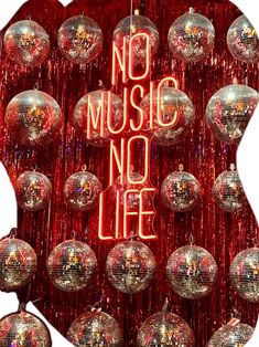 there are many shiny disco balls in front of the words no music, no life