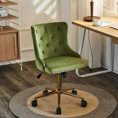 a green office chair sitting on top of a rug in front of a computer desk