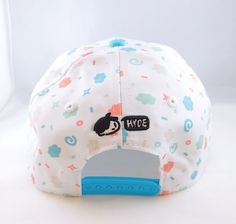 "A patterned snapback cap with our original design, \"Jelly Bunny\"! These colorful little bunnies are sure to make your noggin feel bright and happy. Features an embroidered large jelly bunny on the bill of the cap and the logo of the artist on the back! - 100% polyester - Surface washable - Curved bill - 6 panel design" Summer Snapback Hat With Mesh Back And Curved Bill, Spring Mesh Snapback Hat With Curved Bill, Spring Mesh Snapback Hat, Black Snapback Hat With Mesh Back And Curved Bill, Curved Bill Mesh Baseball Cap With Embroidered Logo, Custom Charms, Snapback Cap, Foil Print, Panel Design