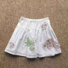 This Skirt Is New Without Tags And Has Never Been Worn. It Is In Perfect Condition! It Is A White Skirt With Embroidery All Over The Skirt. Embroidered Skirted Bottoms For Spring, Spring Embroidered Skirted Bottoms, Fitted White Skirt With Embroidered Hem, White Cotton Bottoms With Embroidered Hem, Cute White Cotton Skirt, Cotton Skirt With Embroidered Hem, White Floral Embroidered Skirt, Cute White Skirted Bottoms, Casual Cotton Skirt With Embroidered Hem