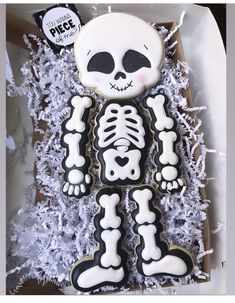 a decorated cookie in the shape of a skeleton