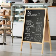 a menu board in front of a restaurant counter