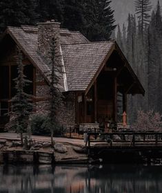 a cabin with a dock in front of it