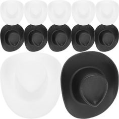 black and white dinnerware set with plates, spoons and saucers on a white background