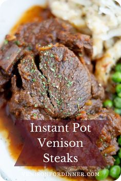 instant pot venison steaks with mashed potatoes and peas on a white plate