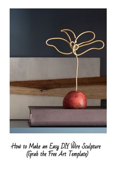 an apple sitting on top of a book with the title how to make an easy diy wire sculpture grab the tree art template