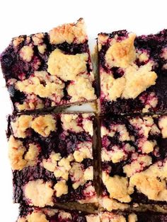 blueberry crumb bars cut into squares on top of each other, ready to be eaten