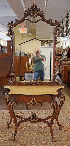 a mirror sitting on top of a wooden table