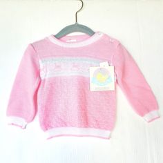 Vintage Baby Girl Pullover Knit Sweater Pink With White Stripe Across Front And White Bands And Cuffs Rocking Horses On Front Size 18 Months New With Tags Dead Stock Vintage White Knitted Sweater For Playtime, Cute Knit Tops For Playtime, Pink Cotton Pointelle Knit Sweater, White Knit Sweater For Playtime, Pink Sweater For Spring Playtime, Pink Spring Sweater For Playtime, Playful White Knitted Top, Spring Pink Sweater For Playtime, Pink Long Sleeve Sweater For Playtime