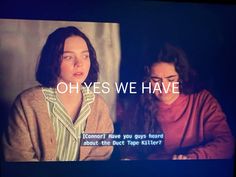 two women sitting next to each other in front of a screen with the words oh yes we have