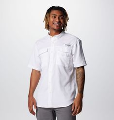 A stain-resistant short sleeve fishing shirt that's built for a day along a sunny shoreline. White Short Sleeve Shirt With Pockets For Beach, White Short Sleeve Beach Shirt With Pockets, Summer Outdoor Short Sleeve Shirt With Pockets, White Summer Camp Shirt For Outdoors, White Summer Camp Shirt For Outdoor, Summer Outdoor White Camp Shirt, Summer Short Sleeve Camp Shirt For Outdoor, Short Sleeve Fishing Shirt For Summer, White Cotton Camp Shirt For Outdoor