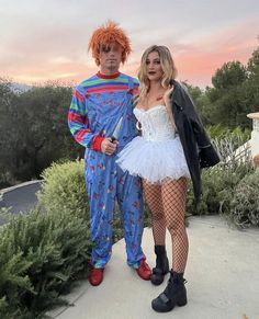 two people in costumes standing next to each other