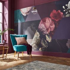 a blue chair sitting in front of a purple wall