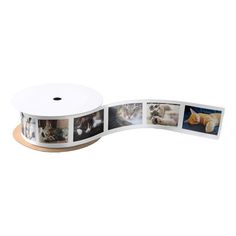 a roll of white paper with pictures of cats on it