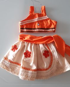 an orange and white dress with flowers on it