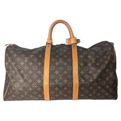 This stylish duffel is crafted of monogram coated canvas with vachetta leather wrap around detailing and rolled top handles with brass hardware. The top zippers open to a cocoa brown fabric interior. Retail $2,570. Designer: Louis Vuitton Material: Monogram coated canvas w/ cowhide leather trim Date/Authenticity Code: 842 Production Year: February 1984 Origin: France Measurements: 21.75"W x 11.25"H x 9.5"D Drop: 4" Interior Lining: Canvas Opening/Closure: 2-Way zip Hardware: Golden metallic piec Cocoa Brown, Brown Fabric, Vintage Louis Vuitton, Id Tag, Leather Wraps, Duffel Bag, Monogram Canvas, Fashion Handbags, Wrap Around